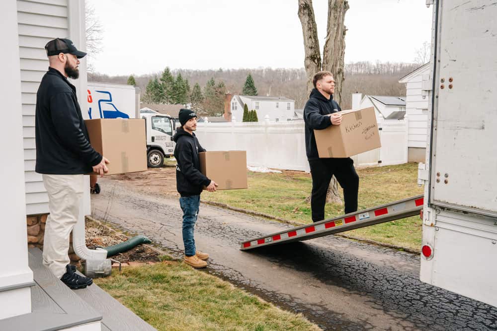 our team loading the packed items into the truck